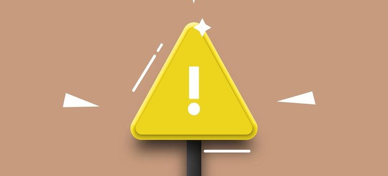 a yellow triangle sign with an exclamation mark