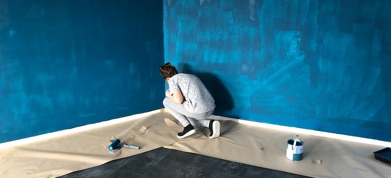Woman painting the walls