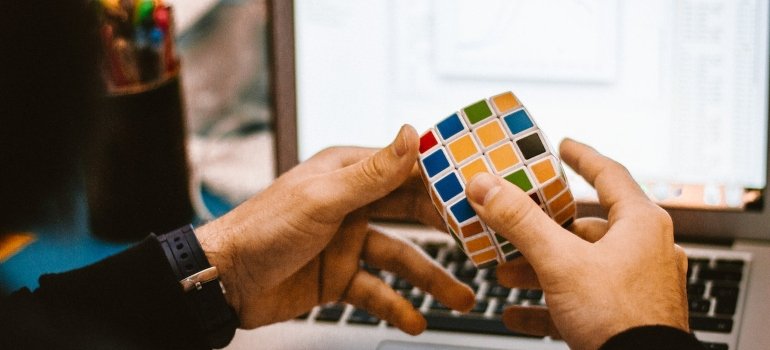 Picture of a person playing with a cube