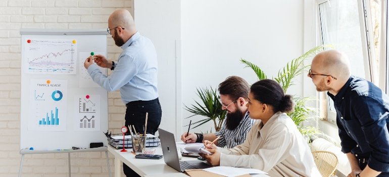 People having a meeting about relocating and using some tips to make NYC office relocation easy for them