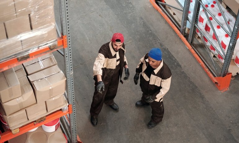 two men in a warehouse