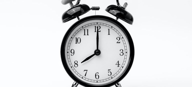 A black and white photo of an alarm clock