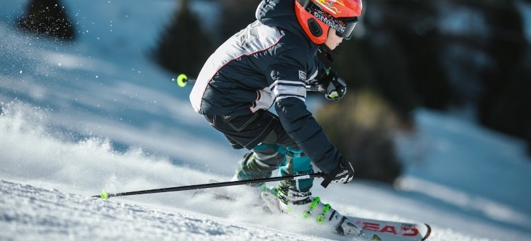 Picture of a man skiing and wondering how to store winter gear in a small apartment