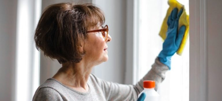 A woman cleaning the window