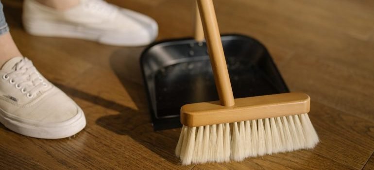 A woman sweeping the floor