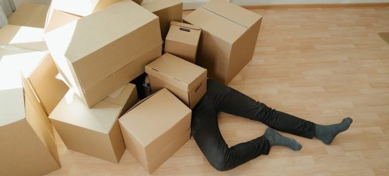 A man under the boxes getting ready to securely store valuables in the Bronx