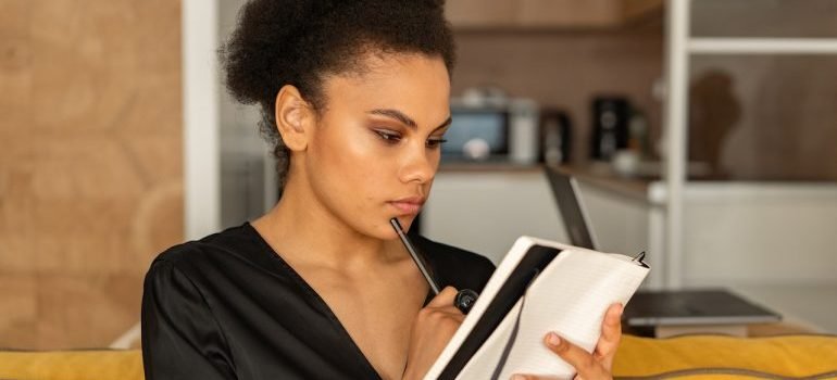 A girl thinking and writing