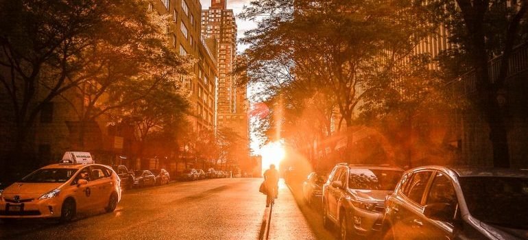 A sunset in NYC with the person on the street