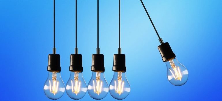 Five light bulbs hitting each other