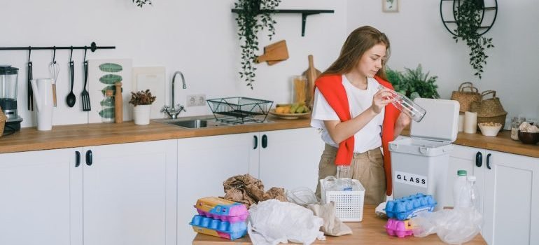 A girl cleaning her kitchen