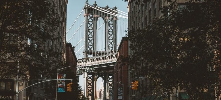 Brooklyn bridge photographed in between buildings