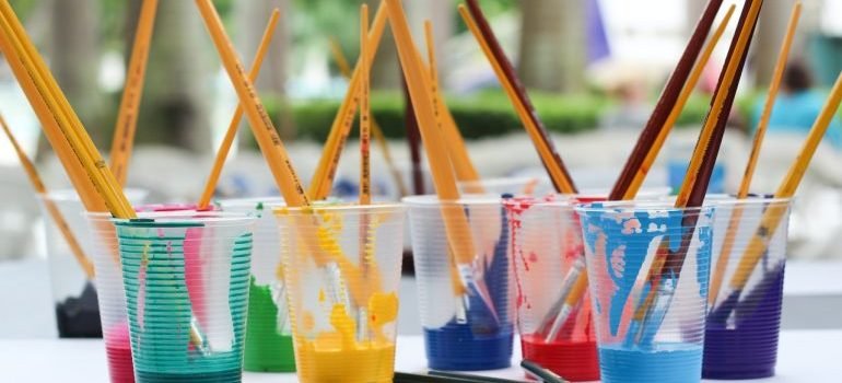 Paint brushes in mugs