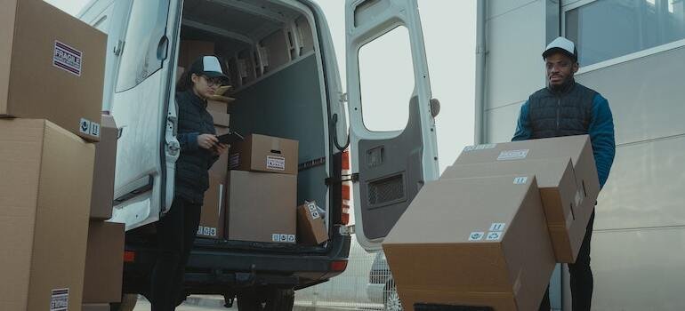 People unloading a van
