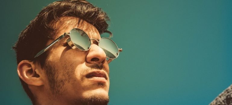 A guy with sunglasses on the heat