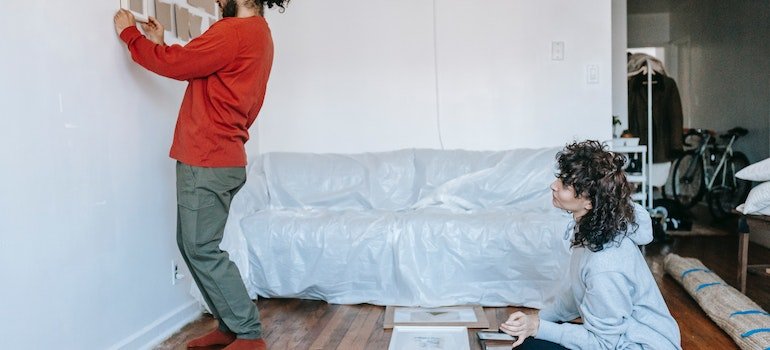 a woman trying to declutter and prepare house for a hot summer