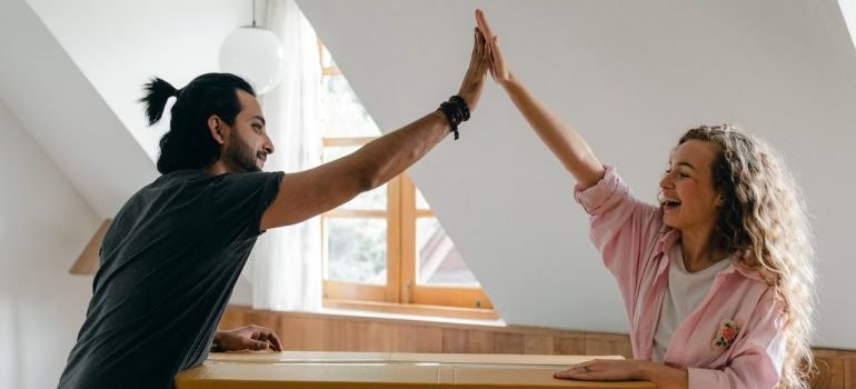 A couple throwing a high five