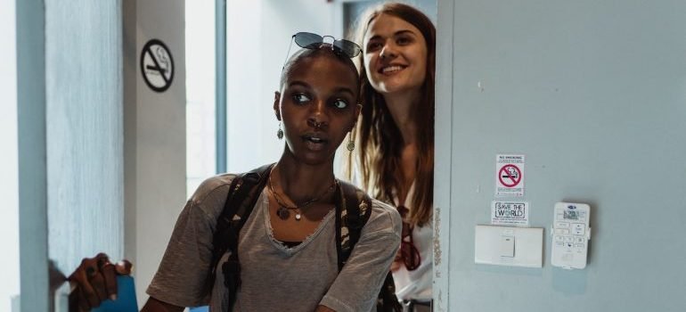 Girls entering a dorm room