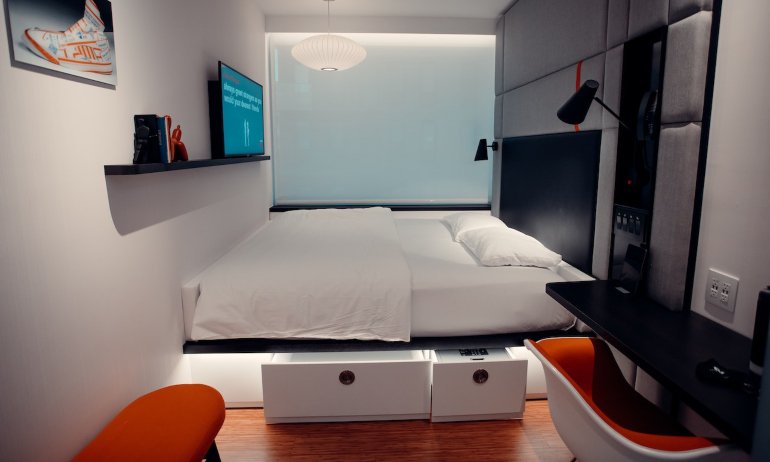 A bed with built-in drawers which is one of the ideas to steal from tiny Bronx homes.