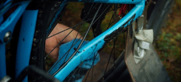 Picture of a person cleaning a bike