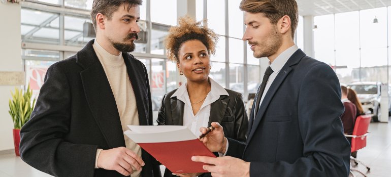 people discussing lease terms with an agent which is what you should do to choose the right storage unit for your needs in the Bronx