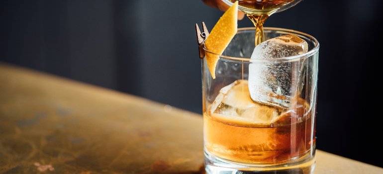 a glass with an alcoholic drink in it
