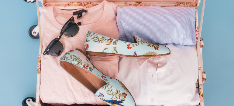 A set of colorful clothes that should be on a college packing list of essentials for your dorm room