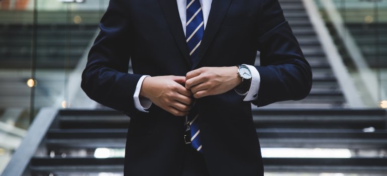 a man in a suit in one of the best Manhattan neighborhoods for your big move