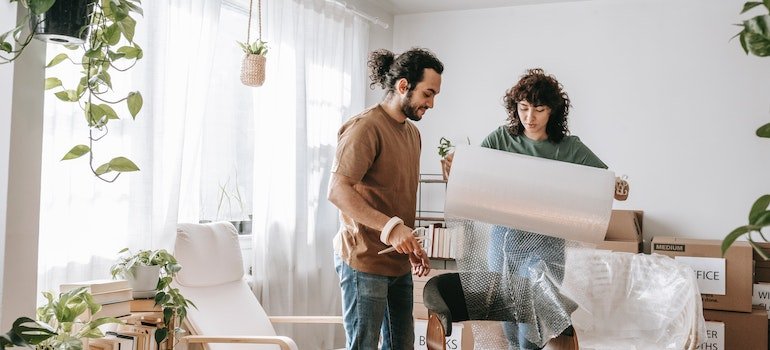 Couple wrapping a chair