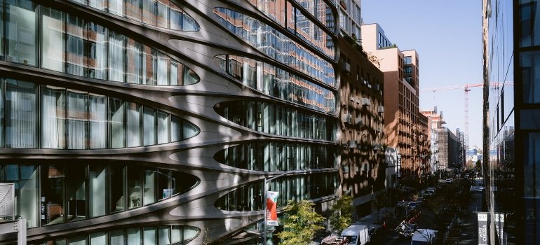 A street in New York with concrete buildings and cars.