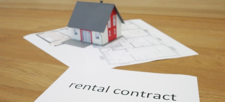 mini model of the house on the rental contract