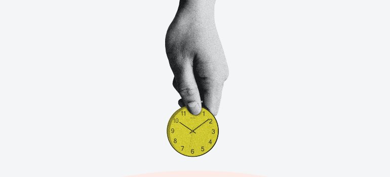 a hand holding a time piece as a coin and putting it into a piggy bank