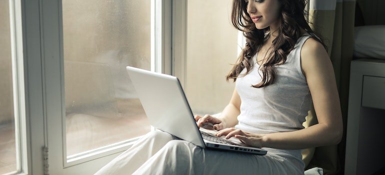A person reading about what to do with sentimental items on a laptop
