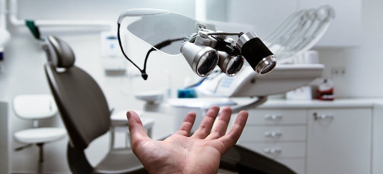 a hand pointing at medical assets, representing how moving to Chelsea can be a smart decision since its healthcare options are so diverse