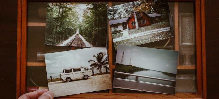Four photographs on a glass cabinet