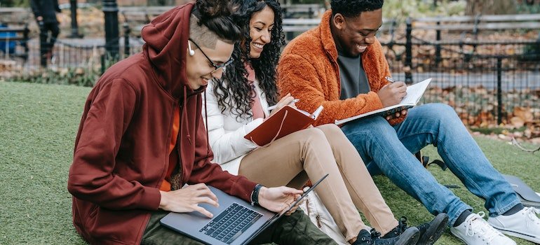 Students studying together in a park