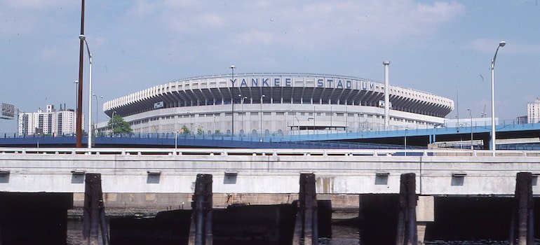 Yankee Stadium under a blue sky.