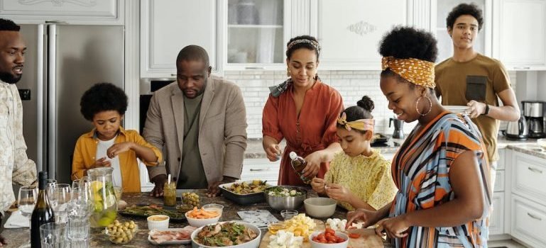 A big family cooking and talking about things to do on Thanksgiving in the Bronx