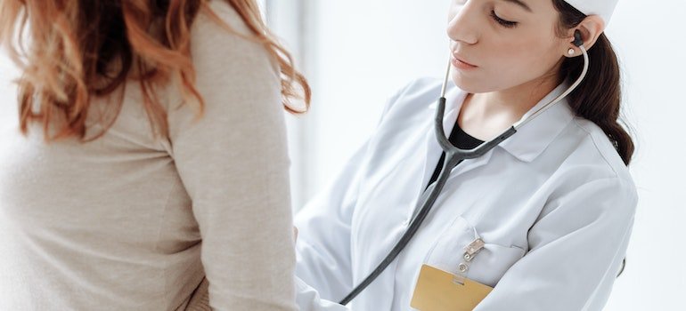 A doctor diagnosing their patient