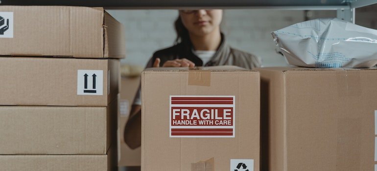 A worker at a storage unit in Morrisania organizing items