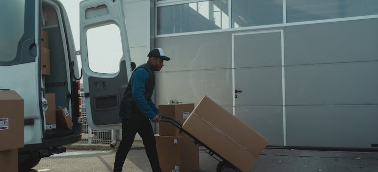 A storage company employee taking boxes to the storage units Upper East Side locals love to use