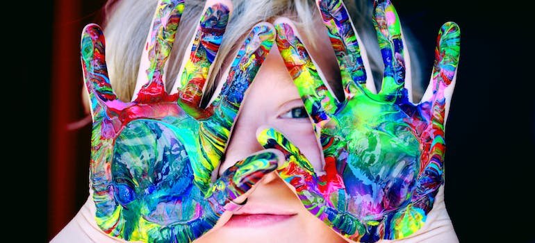 A child with painted hands
