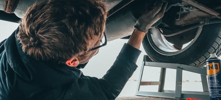 A mechanic doing check-up to prepare your car for winter storage