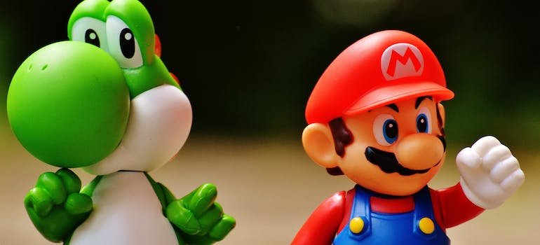 A Yoshi and a Super Mario figurine