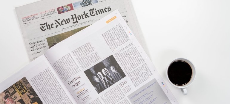 A newspaper on the table people read after they move to Castle Hill.