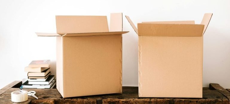Two cardboard boxes on a table after unpacking from a move from Lower Manhattan to Morningside Heights