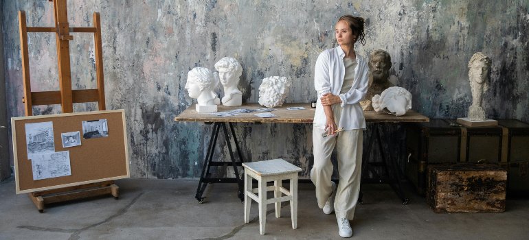 An artist in her private gallery.