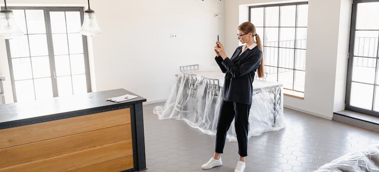 A person taking pictures of furniture