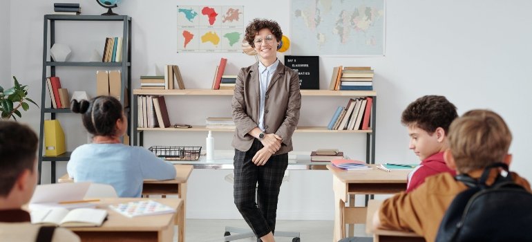 A teacher in a classroom after their move to Highbridge.