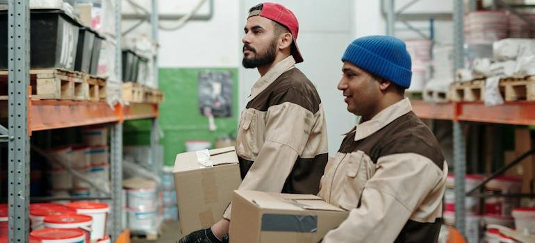 Two men working at a storage facility.