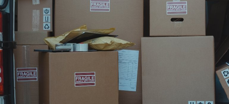 A storage unit with labeled boxes belonging to a person who knows that storage units can expand your apartment.